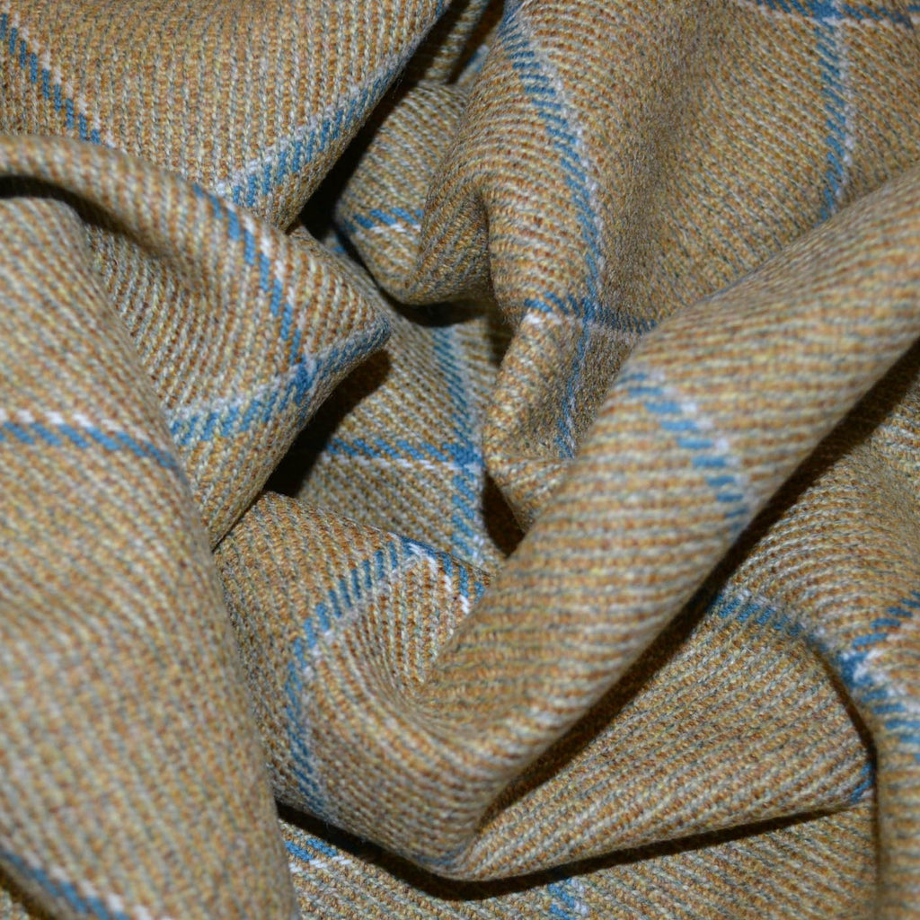 Close-up of premium tweed fabric showcasing its classic pattern and textured weave in earthy tones. Ideal for creating sophisticated jackets, tailored suits, and elegant home decor.