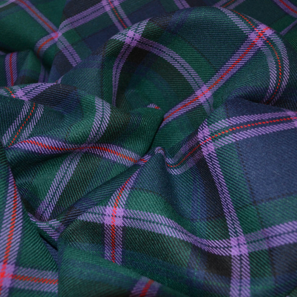 Tartan fabric featuring a traditional, crisscross pattern of intersecting horizontal and vertical lines in various colors, ideal for creating classic kilts, skirts, and elegant garments with a timeless design.