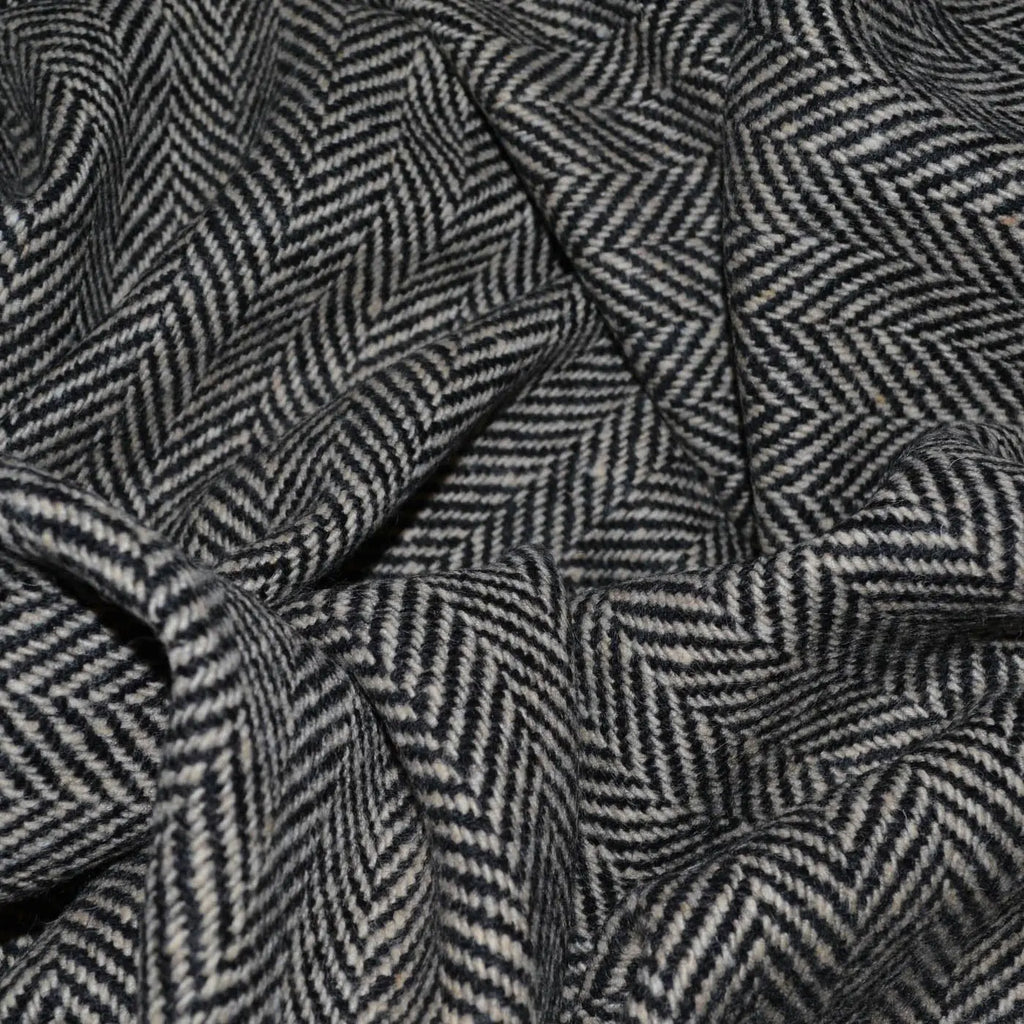 Close-up of all wool coating fabric, showcasing its rich texture and sturdy weave, ideal for creating durable and elegant outerwear like coats and jackets.