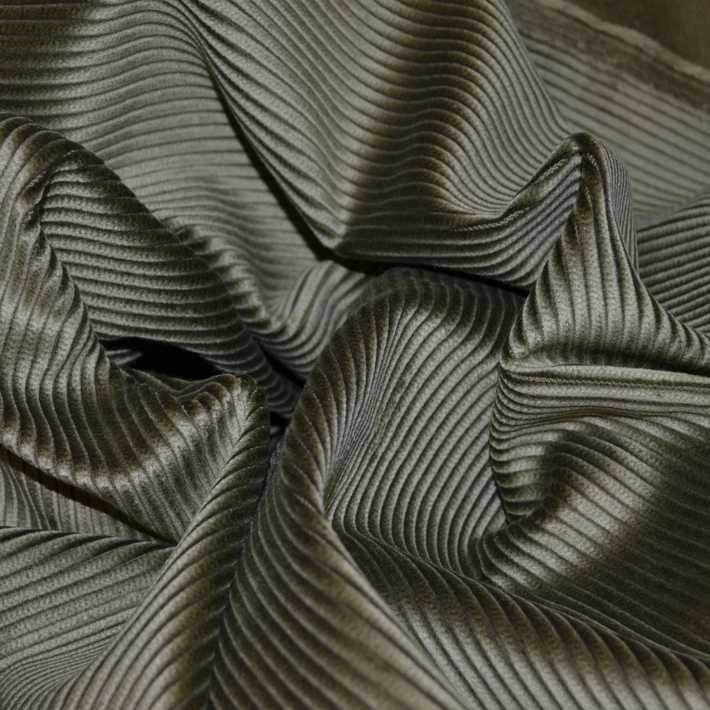 Close-up of a soft 8 wale corduroy fabric showcasing fine ribs and texture.