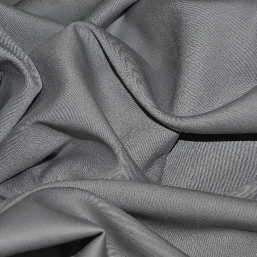 Close-up of Wool Venetian fabric, showcasing its luxurious, slightly lustrous texture combined with the warmth and durability of wool, perfect for elegant garments and home decor.