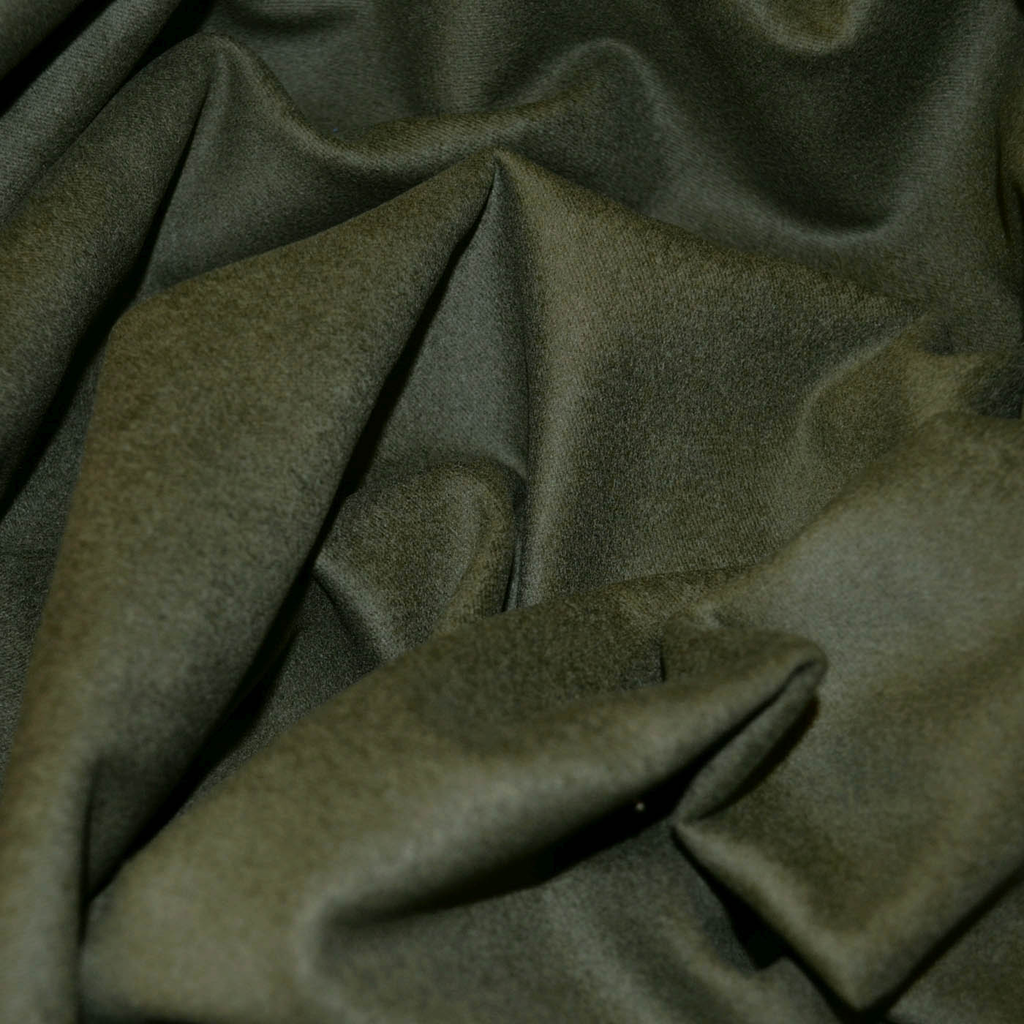 Close-up of moleskin fabric showcasing its soft, velvety texture in a rich, muted color. Ideal for both stylish apparel and durable upholstery projects.