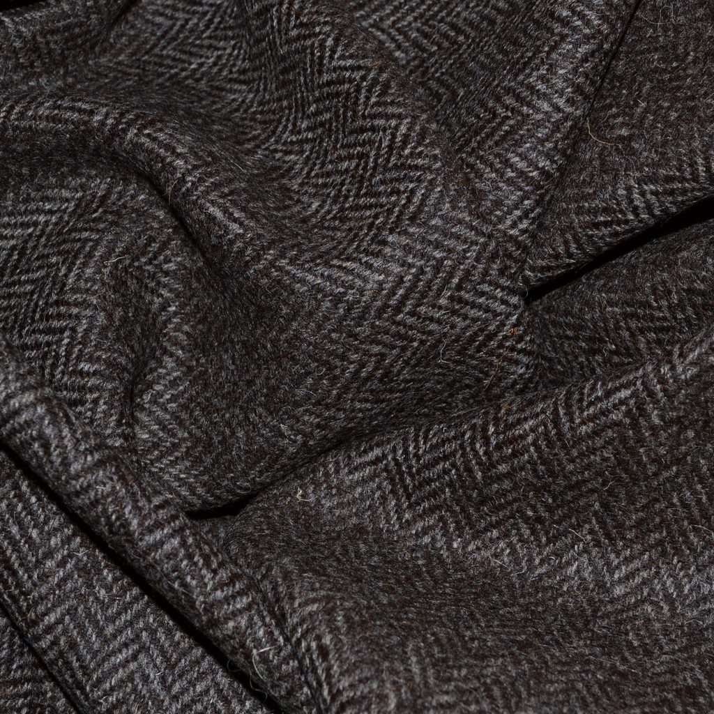 Herringbone fabric from Yorkshire Fabric, characterized by its distinctive V-shaped, zigzag pattern, known for its durability and classic style. Ideal for creating elegant, tailored garments like jackets, coats, and trousers with a timeless look.