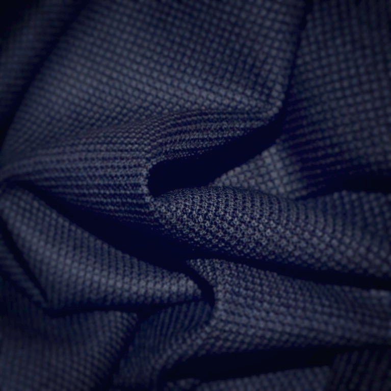  Birdseye fabric from Yorkshire Fabric, known for its subtle, textured pattern resembling small diamonds or dots. This durable and refined fabric is perfect for crafting elegant, tailored suits and jackets with a sophisticated, understated design